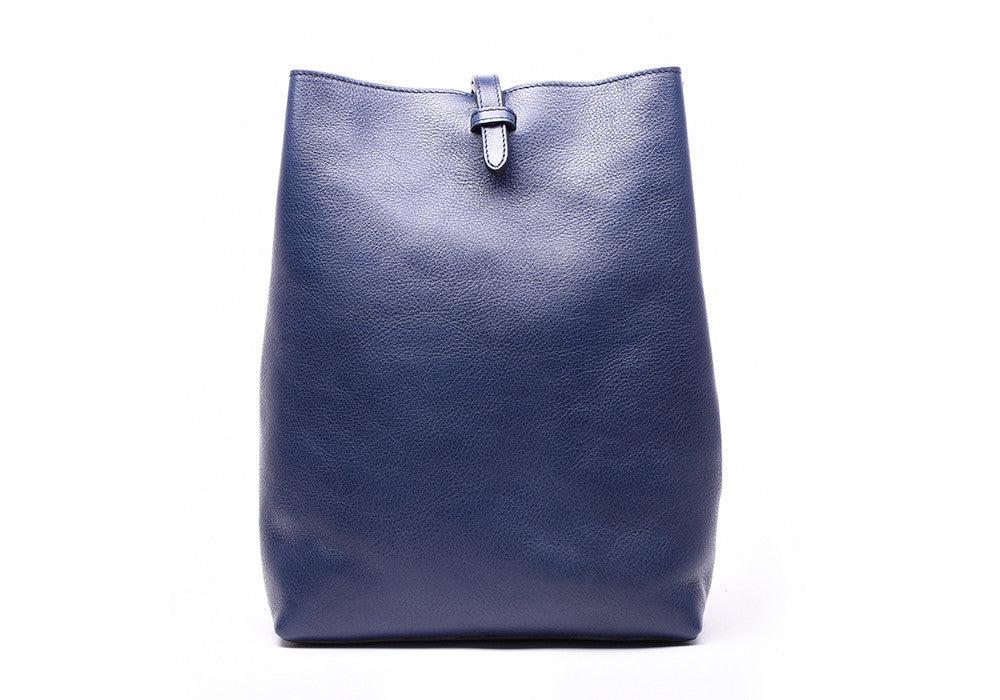 Front Leather View of The Sling Backpack Indigo